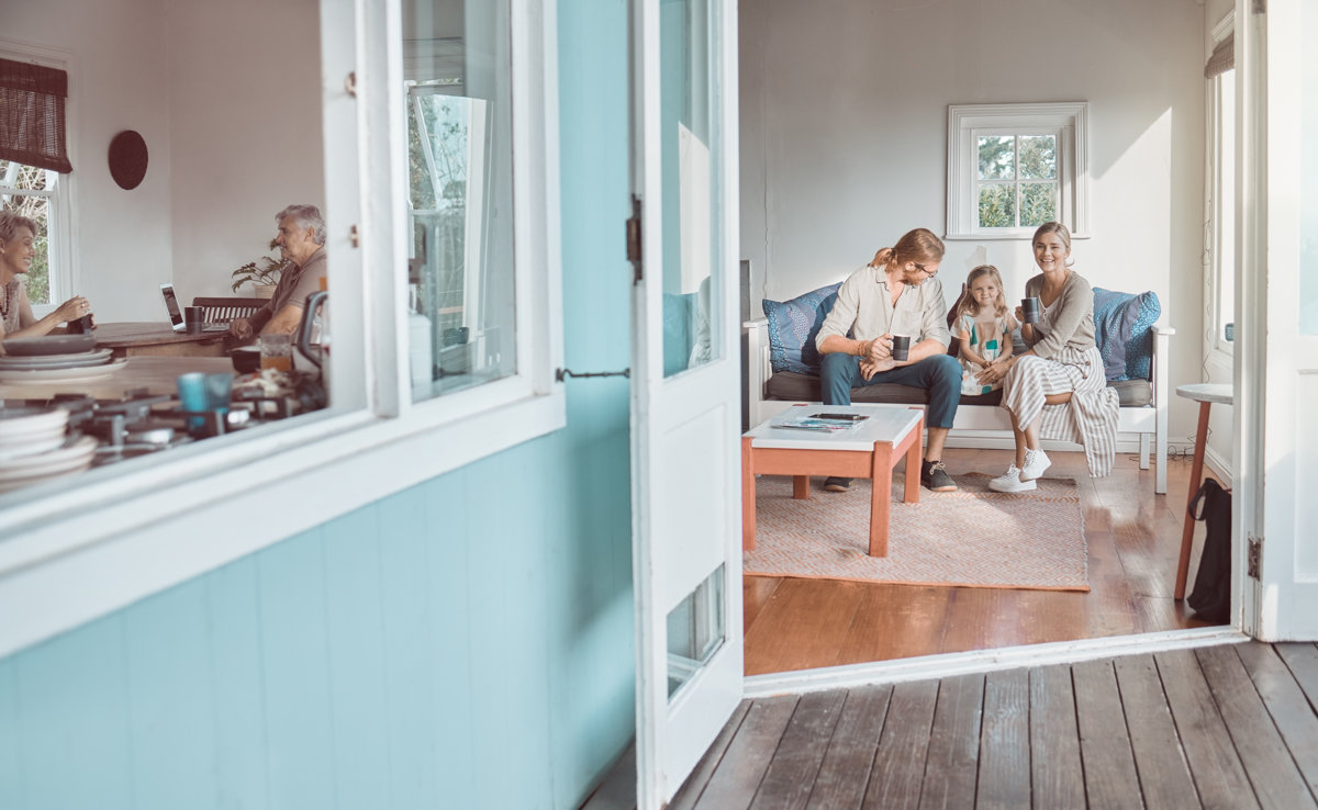 Shot of a young couple and their daughter sitting together at home.